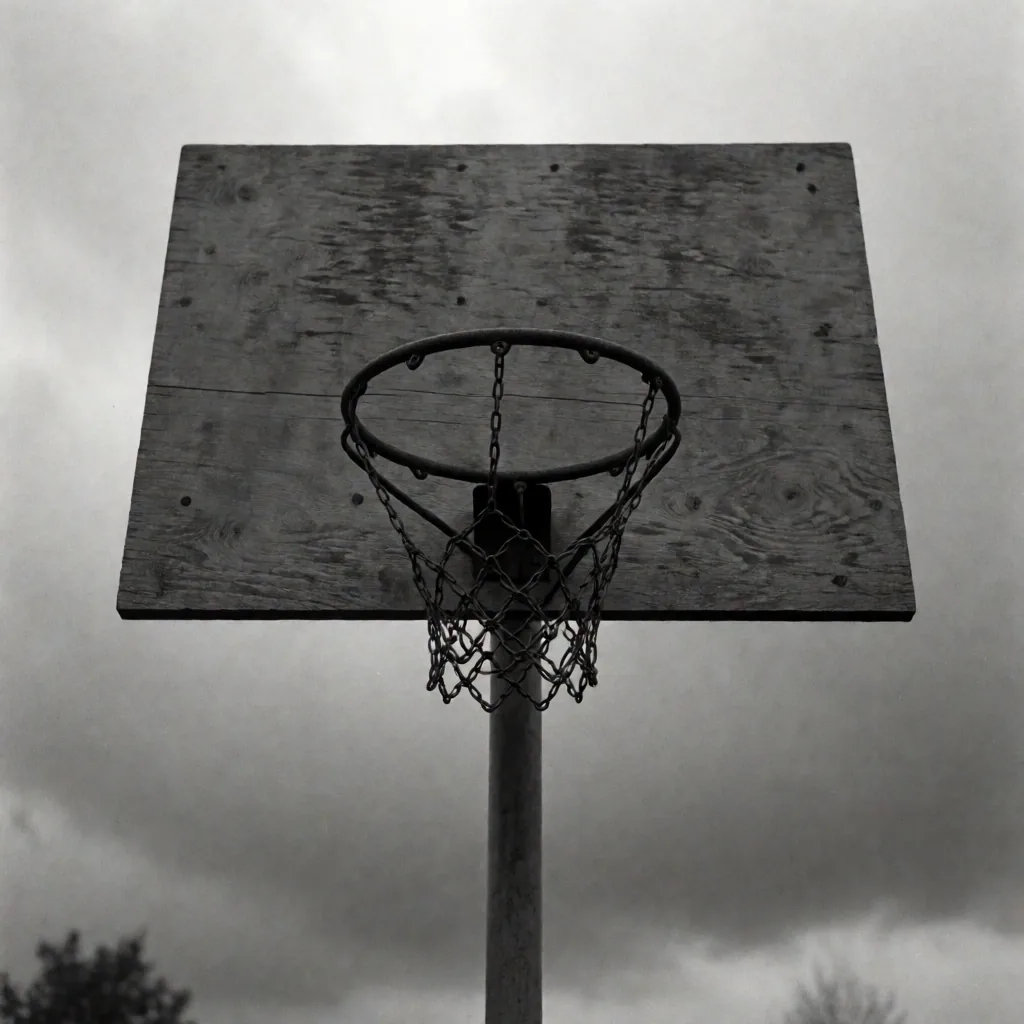 Weathered outdoor basketball court showing decades of community use